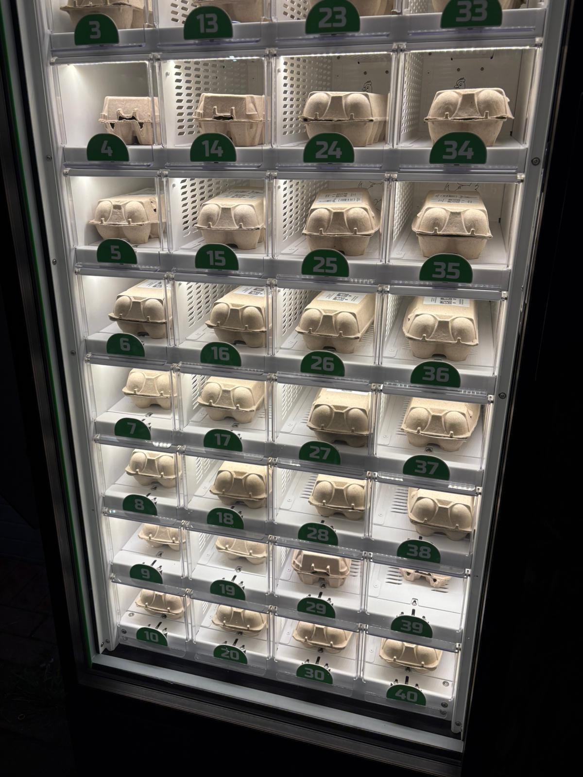 Egg cartons in numbered vending compartments